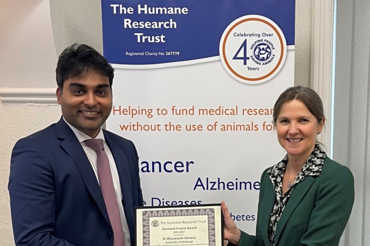 A picture of Dr Alison Giles presenting Dr Bhuvaneish Thangaraj Selvaraj with the Diamond Project Award which is a research grant from the Humane Research Trust.