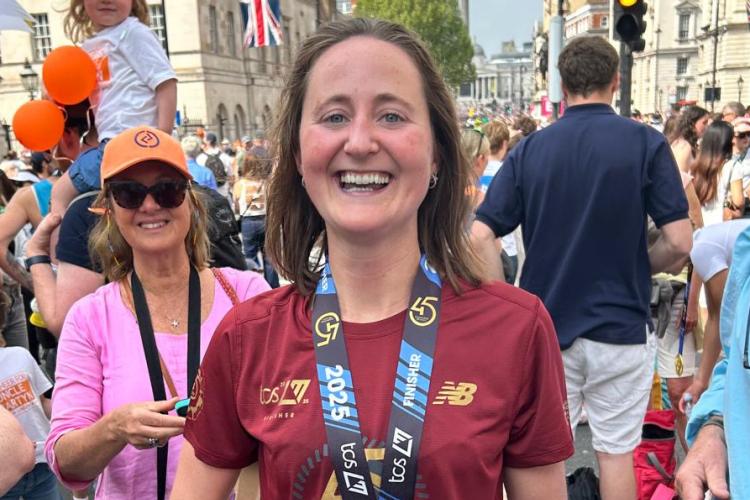 Lucy Comyn after her run, wearing her medal