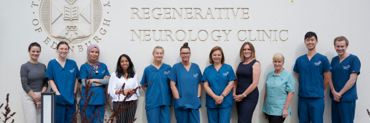 Group picture of staff including NHS Lothian staff, University of Edinburgh research staff . They are standing outside the building of the Anne Rowling Clinic.