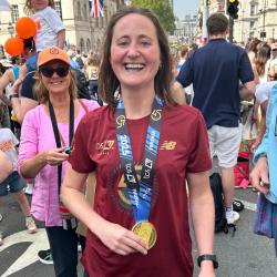 Lucy Comyn after her run, wearing her medal