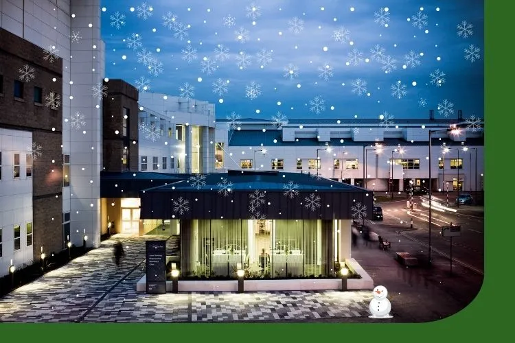 The Anne Rowling Clinic building with snowflakes and a snowman